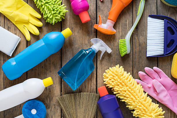Household item cleaning products on wood table